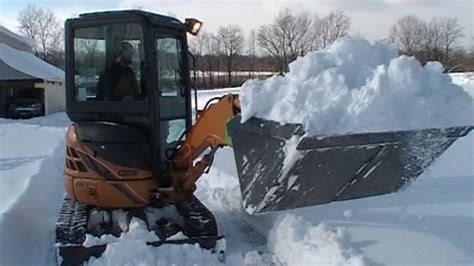 how to operate an mini excavator|mini excavator plowing snow.